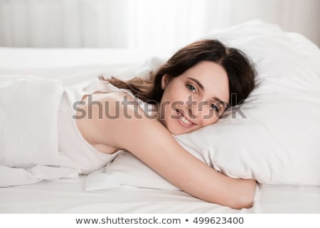 Stock photo: Nudes Attractive Girl Lying In Bed