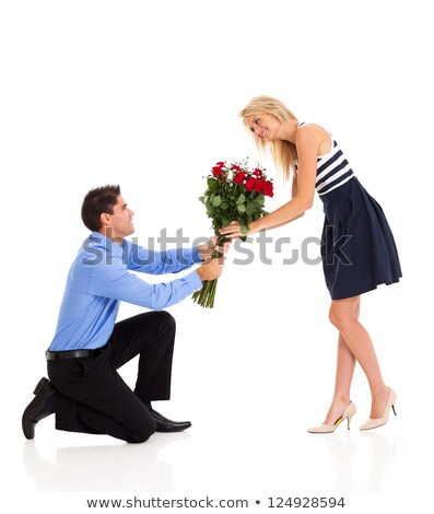 Foto stock: Blonde Woman Accepts Gift Of Red Roses