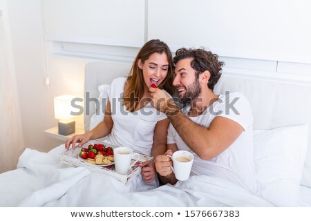 Foto stock: Happy Couple Having Breakfast Together At The Weekend