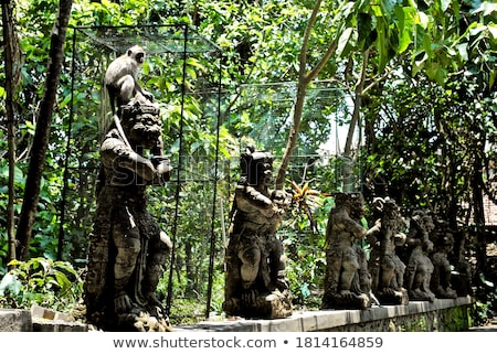 Foto stock: Monkey Sitting On Shrine