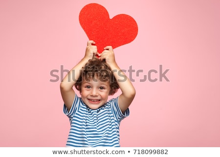 Stock photo: Portrait Of Boy Holding Heart Shape