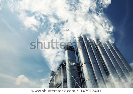 Zdjęcia stock: Polluted Smoke Against A Clear Blue Sky From The Tall Chimney