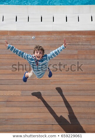 ストックフォト: Boy 8 10 Leaping Into Air Aerial View