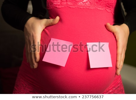 Stock fotó: Pregnant Belly With Sticky Note