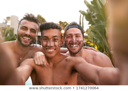 Stock foto: Three Lads Relaxing At Home