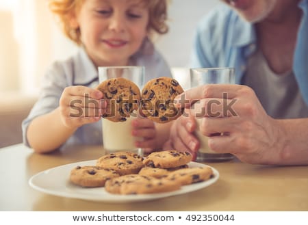 Stockfoto: Little Boy Eating Cookies