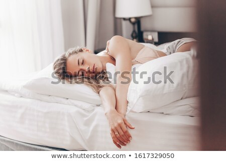 Stockfoto: Cheerful Blonde Girl In Bed
