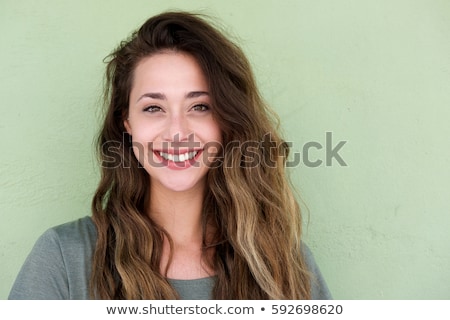 Foto d'archivio: Close Up Portrait Of A Cute Young Woman Smiling