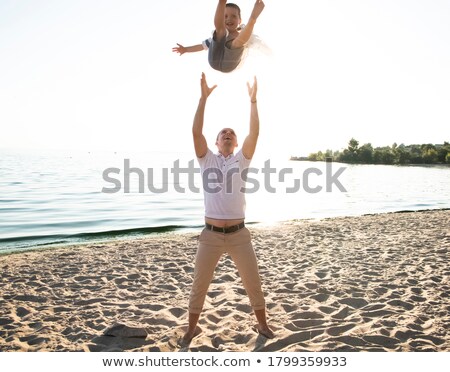 Stock photo: Dad Tossing His Lovely Child