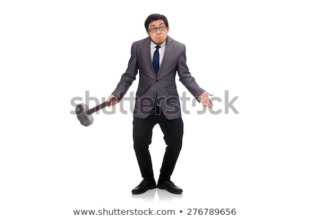 Stock photo: Young Businessman Holding A Tool Isolated On White