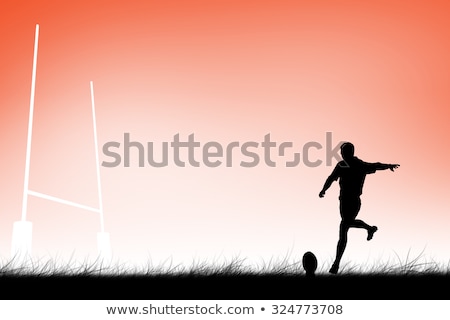 Foto stock: Rugby Player Doing A Drop Kick