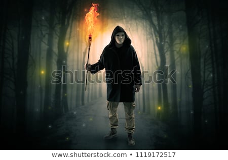 Stockfoto: Mysterious Man Coming From A Path In The Forest With Glowing Lantern Concept