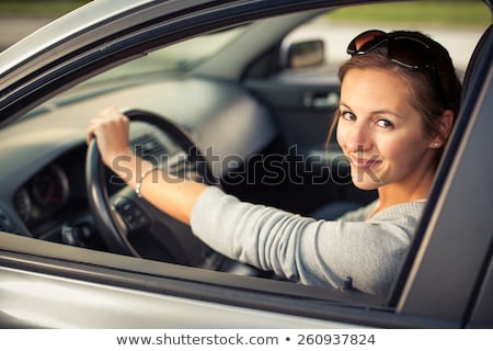 Stock fotó: Pretty Young Woman Driving Her New Car
