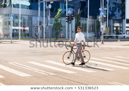Stockfoto: Young Man With Fixed Gear Bicycle On Crosswalk