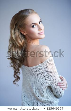 [[stock_photo]]: Young Woman Looking Over Her Shoulder