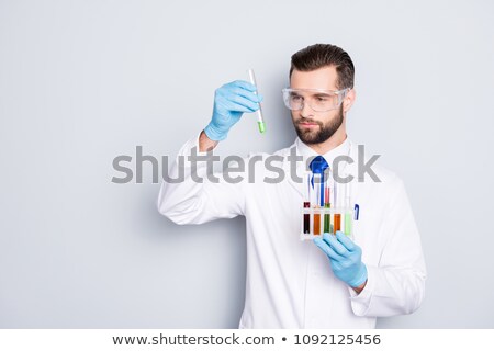 Foto stock: Doctor Holding Chemical Glassware