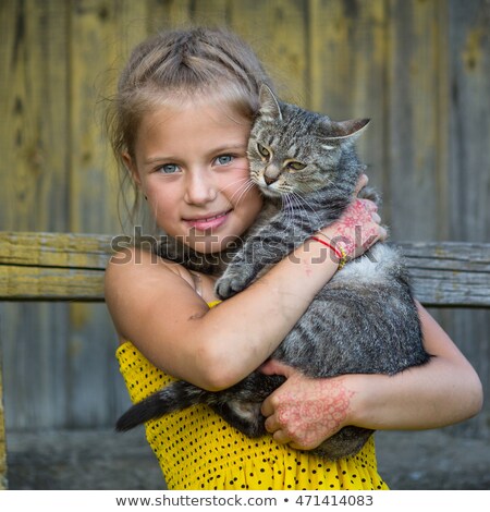 Foto stock: Pretty Little Girl With Her Cute Kitten