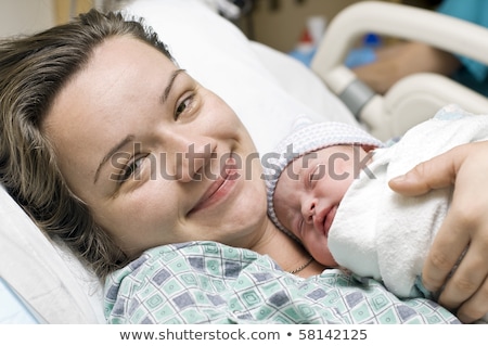 Stockfoto: Portrait Of A Newborn Baby Girl In Maternal Hospital