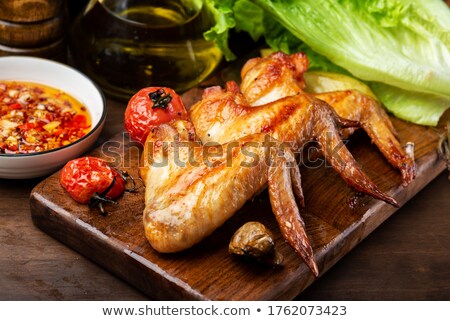 Stock photo: Chicken Wings With Baked Potato And Pepper