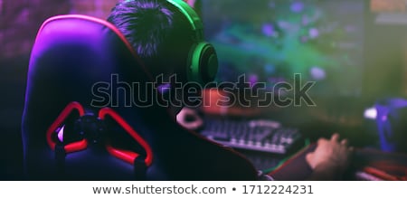 Stock fotó: Man In Headset Playing Computer Video Game At Home