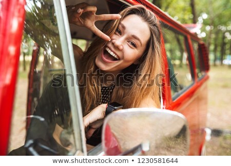 Stock fotó: Hippie Friends At Minivan Car Showing Peace Sign