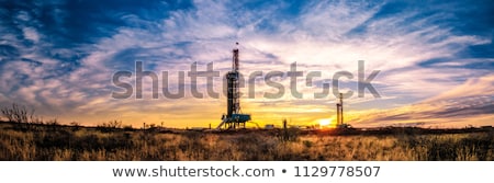 Stock photo: Oil Field Drilling Rig And Oil Pump