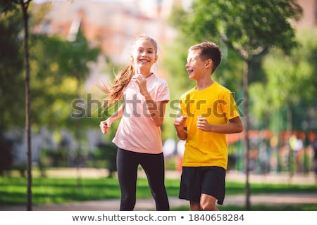 Stock photo: Two Twins Sportsmen Brothers At The Stadium Outdoors