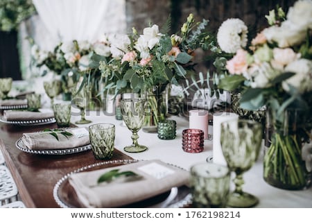 Foto stock: Wedding Banquet Tables With Flowers Decoration