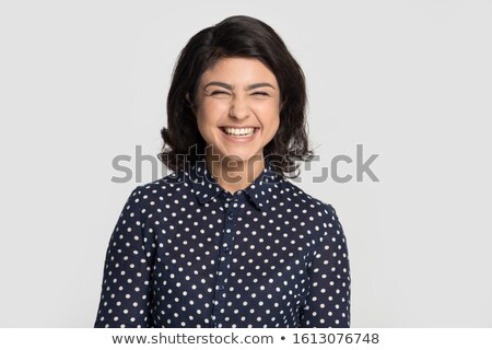 [[stock_photo]]: Photo Of Funny Overjoyed Female Has Fun Alone Laughs Joyfully And Shows Tongue Keeps Eyes Shut Ex