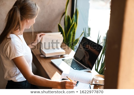 Сток-фото: Portrait Of A Pretty Female Student With Laptop And Exercise Boo