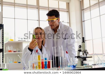 [[stock_photo]]: Asian Lab Worker Doing Liquid Sample Analysis
