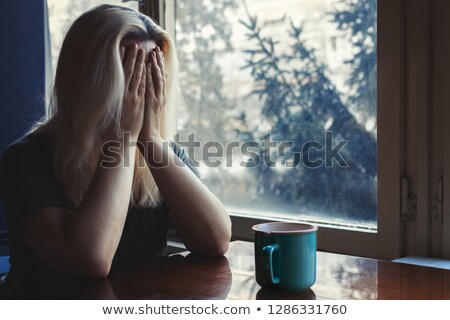 Stock fotó: Unhappy Blond Woman With Head In Hands