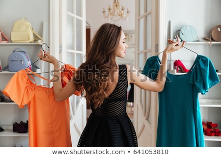 Zdjęcia stock: Woman Choosing Cloth In Store