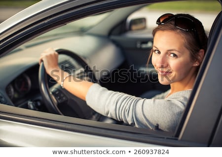 Foto d'archivio: Pretty Young Woman Driving Her New Car