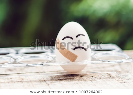 [[stock_photo]]: Broken Egg With Sticking Plaster Concept Of Brittleness And Pain