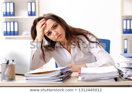 Stock photo: Young Female Employee Unhappy With Excessive Work