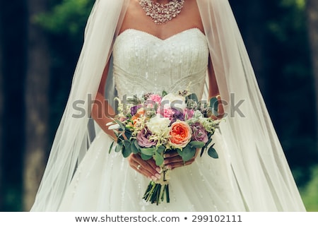 Foto stock: Beautiful Bride Is Holding A Wedding Colorful Bouquet