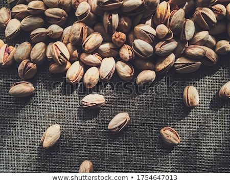 Zdjęcia stock: Pistachio Nuts On Rustic Linen Background