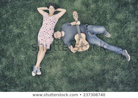 Woman With Two Guitars On Grass Foto stock © Orla