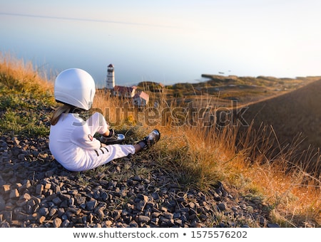 Stock fotó: Astronaut Girl With Silver Uniform And Glass Helmet