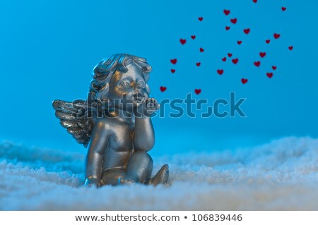 Angel In A Beautiful Blue Snow Setting Shows Heart Stock photo © 3523studio