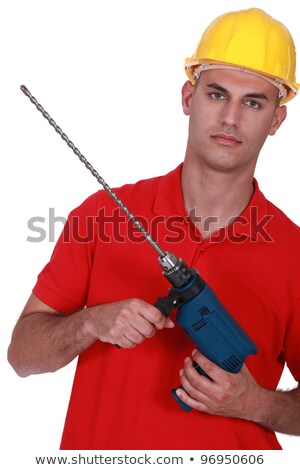 [[stock_photo]]: Man Holding Powerdrill With Long Bit