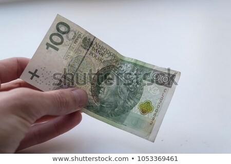 [[stock_photo]]: Polish Currency Banknotes Hundred Zloty Stacked In Hand