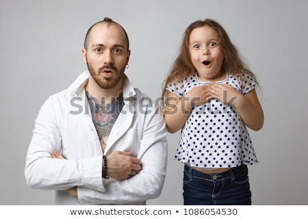 Stock photo: Woman Looking Amazed On Little Man