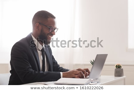 Foto stock: Portrait Of Pensive Businessman Sitting And Looking To Side