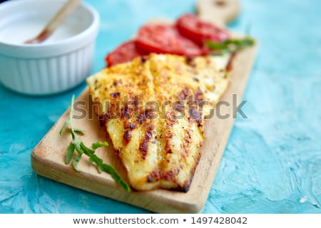 Foto stock: Grilled Pike Fillet With Tomatoes On Wooden Board