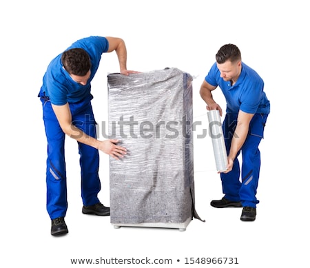 Stock photo: Male Movers Wrapping The Home Appliances With Plastic Wrap