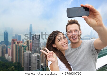Zdjęcia stock: Caucasian Couple In Hong Kong Young People Taking Selfie Picture At Viewpoint Of Famous Attraction