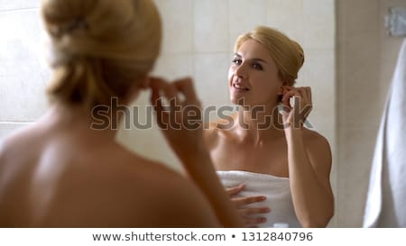 Stok fotoğraf: Young Woman Cleaning The Ear