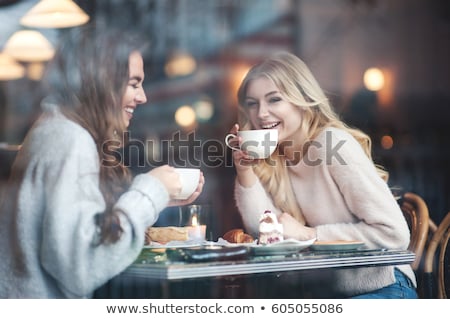 Сток-фото: Women Friends Looking At Cakes In Cafe
